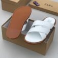 High-quality white slide sandals with brown soles, displayed in an open shoe box with the brand name ZARA.
